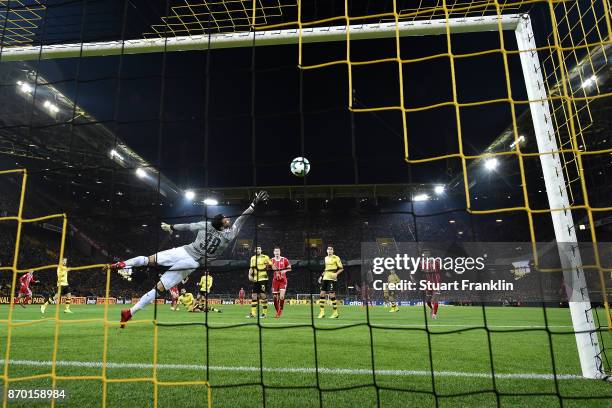 Roman Buerki of Dortmund can't safe a shot by Arjen Robben of Bayern Muenchen who shoes the first goal to make it 0:1 during the Bundesliga match...