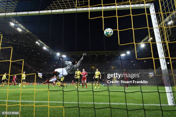 Roman Buerki of Dortmund can't safe a shot by Arjen Robben of Bayern Muenchen who shoes the first goal to make it 0:1 during the Bundesliga match...