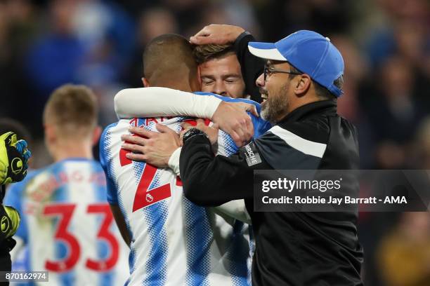 David Wagner head coach / manager of Huddersfield Town celebrates with Mathias Zanka Jorgensen of Huddersfield Town and Martin Cranie of Huddersfield...