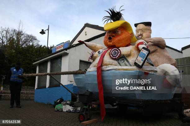 Effigies of US President Donald Trump and North Korean leader Kim Jong-Un are parked on a sidestreet before being paraded through the streets of...