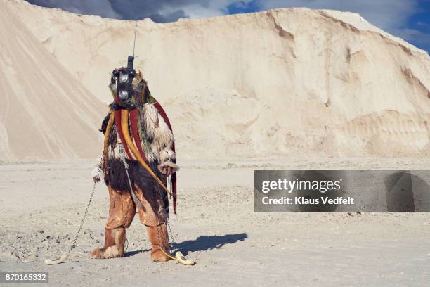 man standing alone, wearing amazing costume - made out of old phones - costume designs stock pictures, royalty-free photos & images