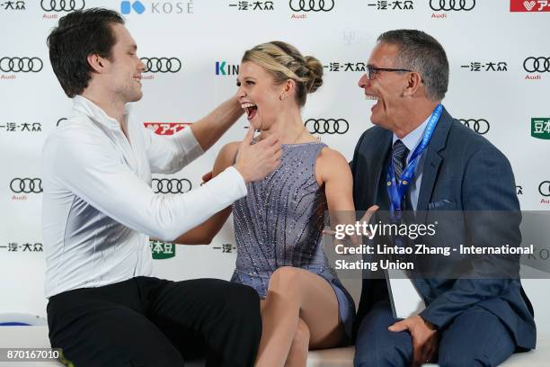 Kirsten Moore-Towera and Michael Marinaro of Canada react after competing in the Pairs Free Skating on day two of Audi Cup of China ISU Grand Prix of...