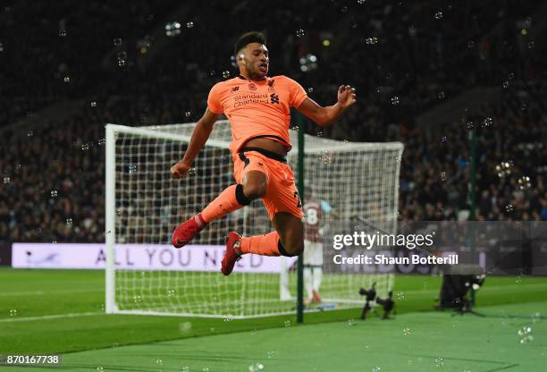 Alex Oxlade-Chamberlain of Liverpool celebrates scoring his sides third goal during the Premier League match between West Ham United and Liverpool at...