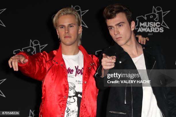 Cesar Laurent de Rummel and Dorian Lauduique of the French band Ofenbach pose upon their arrival to attend the 19th NRJ Music Awards at the Palais...