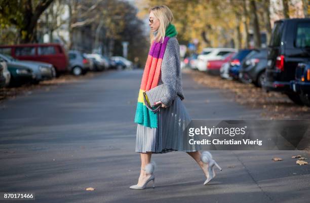 Sonia Lyson wearing grey Jimmy Choo wild leder pumps with furs, grey Zara midi pleated skirt, multi colour scarf Zara, grey turtleneck knit Zara, Ray...