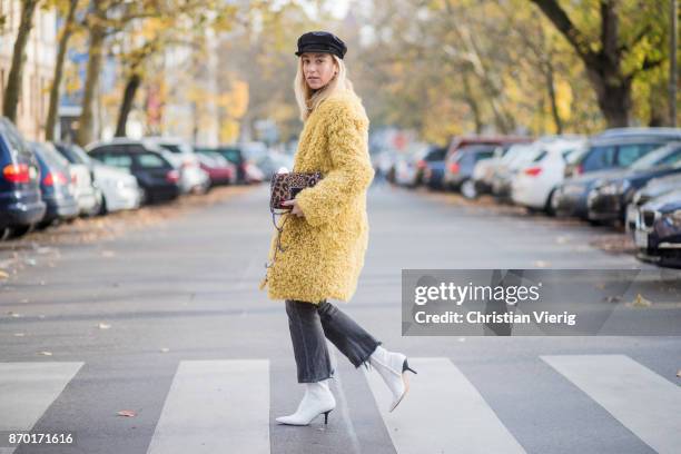 Sonia Lyson Jimmy Choo lockett petite bag hazelnut mix with leopard pony mix, shearling mustard coat Longchamp, black turtleneck & black Zara hat,...