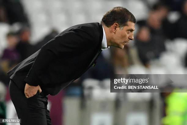 West Ham United's Croatian manager Slaven Bilic reacts after losing the English Premier League football match between West Ham United and Liverpool...