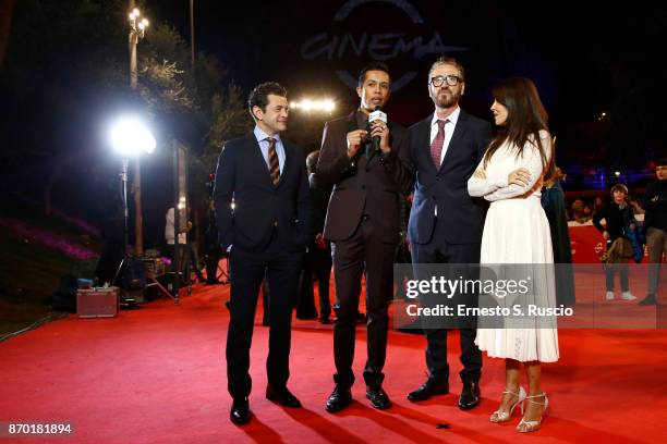 Vinicio Marchioni, Marco Giallini, Sabrina Ferilli are interviewed by Livio Beshir during a red carpet for 'The Place' during the 12th Rome Fest at...