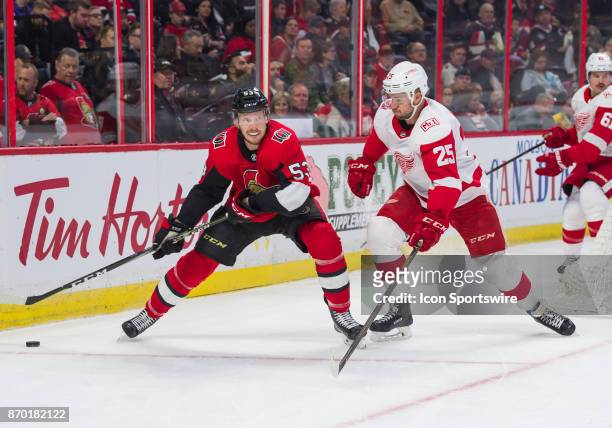 Ottawa Senators Right Wing Jack Rodewald stickhandles the puck in the first period against Detroit Red Wings Defenceman Mike Green during the NHL...