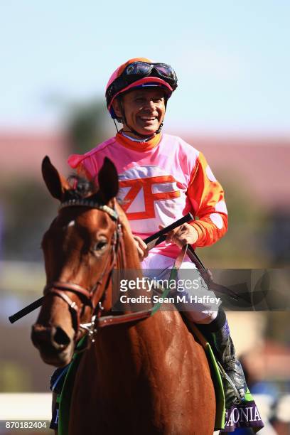 Jockey Mike Smith celebrates after riding Caledonia Road to a win in the 14 Hands Winery Breeders' Cup Juvenile Fillies race on day two of the 2017...