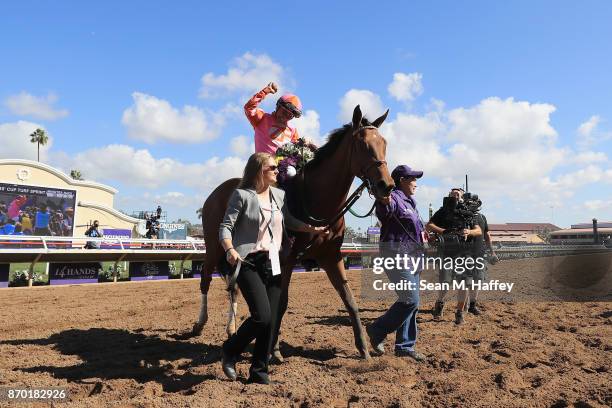 Jockey Mike Smith celebrates after riding Caledonia Road to a win in the 14 Hands Winery Breeders' Cup Juvenile Fillies race on day two of the 2017...