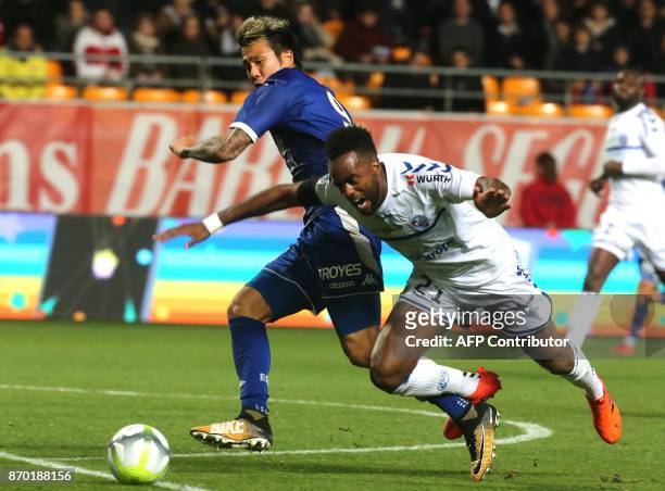 Troyes' North-Korean forward Hyunjun Suk vies with Strasbourg's French defender Yoann Salmier during the French L1 football match between Troyes and...