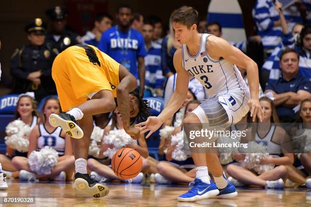 Jacob Long of the Bowie State Bulldogs losses the ball against Grayson Allen of the Duke Blue Devils at Cameron Indoor Stadium on November 4, 2017 in...