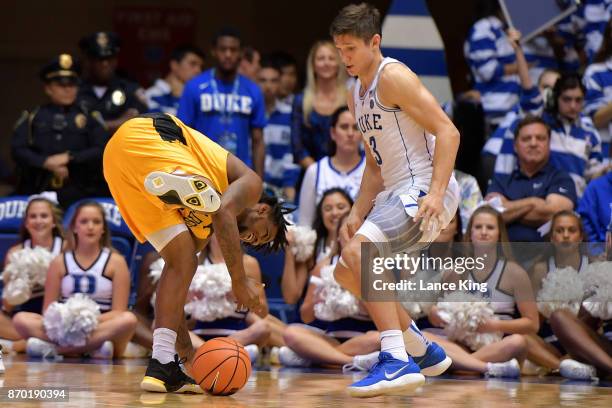 Jacob Long of the Bowie State Bulldogs losses the ball against Grayson Allen of the Duke Blue Devils at Cameron Indoor Stadium on November 4, 2017 in...