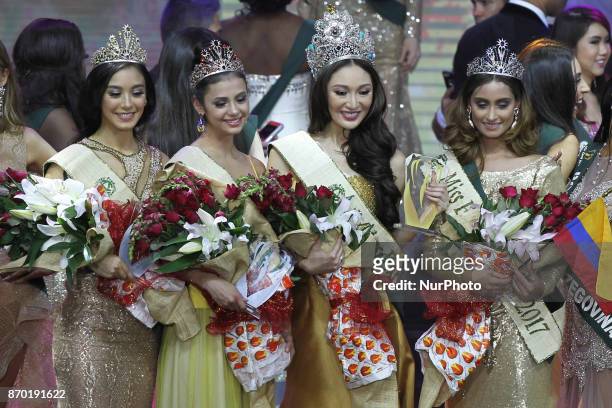 Miss Earth-Air Nina Robertson of Australia, Miss Earth-Fire Lada Akimova of Russia, Miss Earth 2017 Karen Ibasco of the Philippines, and Miss...