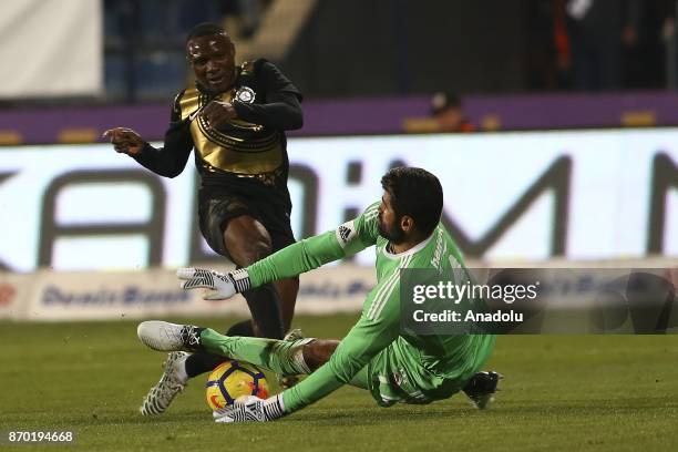 Goalkeeper Volkan Demirel of Fenerbahce in action against Aminu Umar during Turkish Super Lig soccer match between Osmanlispor and Fenerbahce at the...