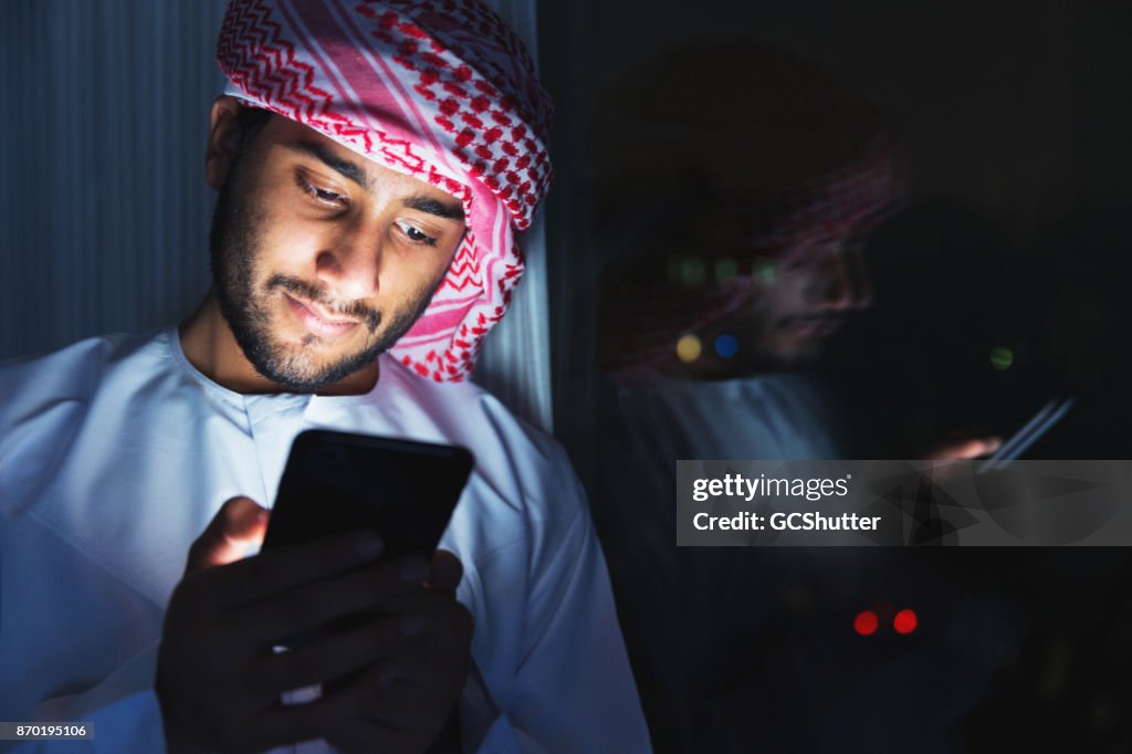 Happily chatting with friends on a phone