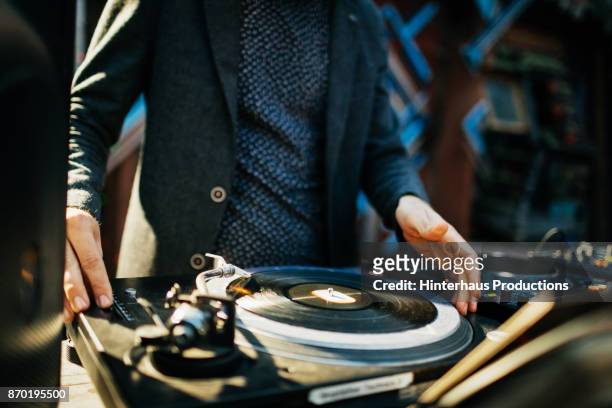 close up of dj performing at open air nightclub - part of a series foto e immagini stock
