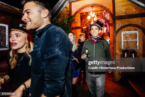 group of friends making their way to dancefloor at nightclub - berlin nightlife stock pictures, royalty-free photos & images