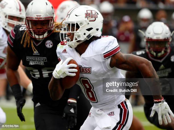 Marquis Young of the Massachusetts Minutemen carries the ball during the first half of an NCAA football game against the Mississippi State Bulldogs...