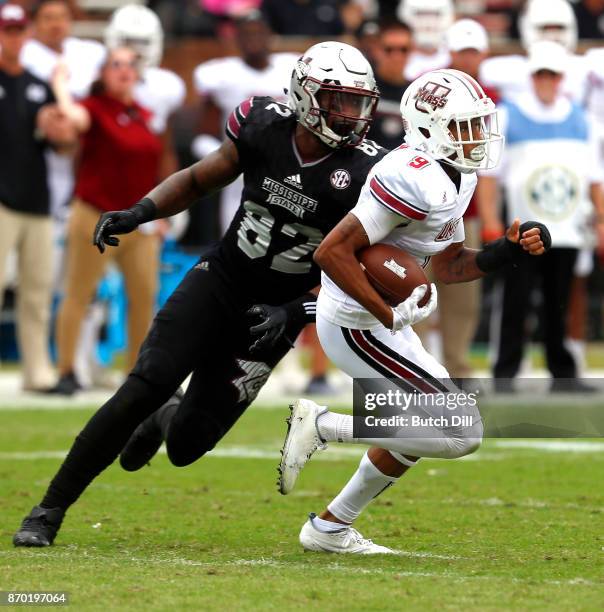 Isaiah Rodgers of the Massachusetts Minutemen returns the ball after he intercepted a pass intended for Jesse Jackson of the Mississippi State...