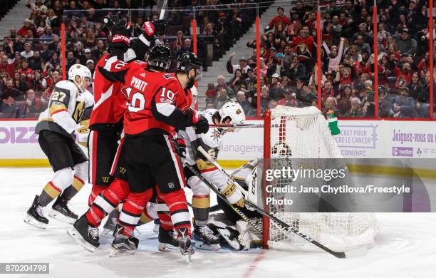 Alexandre Burrows of the Ottawa Senators celebrates his second period goal and 400th career point against of the Vegas Golden Knights with teammates...