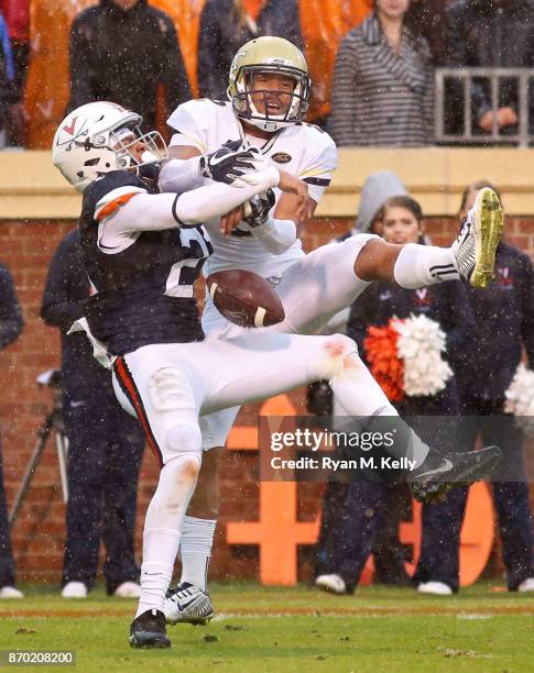 Juan Thornhill of the Virginia Cavaliers breaks up a pass intended for Ricky Jeune of the Georgia Tech Yellow Jackets in the second quarter during a...