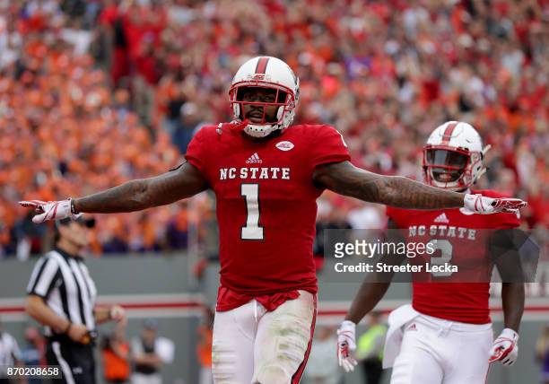 Jaylen Samuels of the North Carolina State Wolfpack reacts after scoring a touchdown against the Clemson Tigers during their game at Carter Finley...