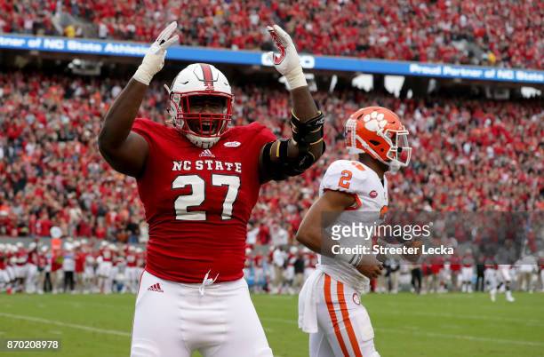 Justin Jones of the North Carolina State Wolfpack reacts after a play as Kelly Bryant of the Clemson Tigers walks off the field during their game at...