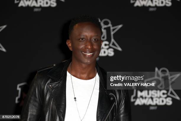 French actor and humorist Ahmed Sylla poses upon his arrival to attend the 19th NRJ Music Awards at the Palais des Festivals, in Cannes, southeastern...