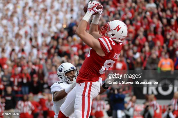 Wide receiver Bryan Reimers of the Nebraska Cornhuskers catches a touchdown against defensive back Alonzo Mayo of the Northwestern Wildcats at...