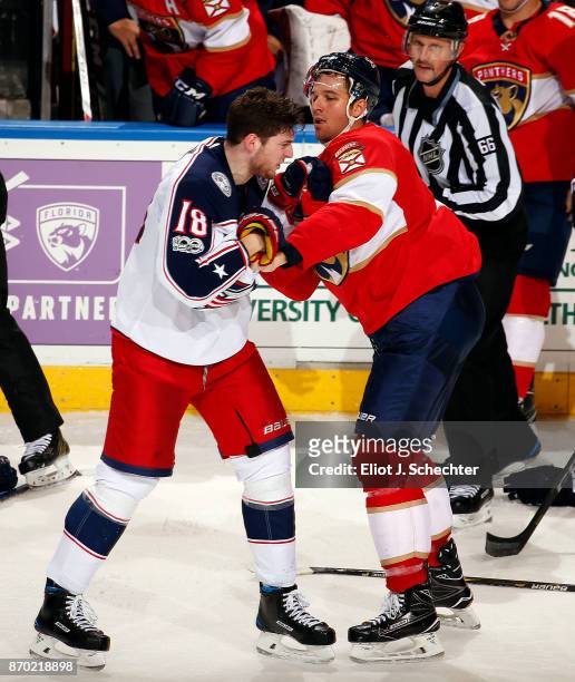 Alex Petrovic of the Florida Panthers fights with Pierre-Luc Dubois of the Columbus Blue Jackets at the BB&T Center on November 2, 2017 in Sunrise,...