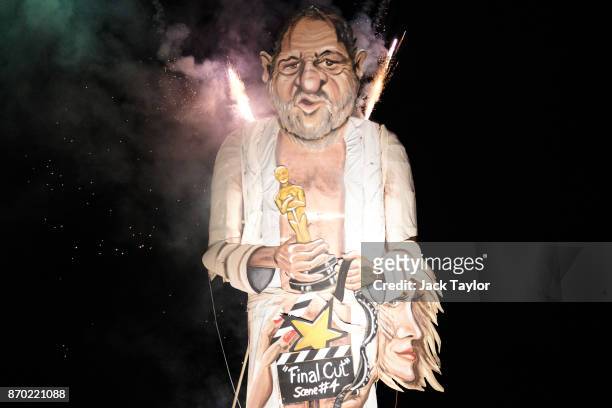An effigy of film producer Harvey Weinstein is burned during a fireworks display at Edenbridge Bonfire Night on November 4, 2017 in Edenbridge,...