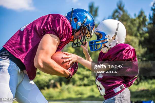 little kids in sport - american football uniform stock pictures, royalty-free photos & images