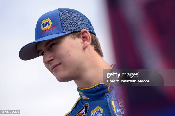 Todd Gilliland, driver of the NAPA Auto Parts Toyota, stands next to his car during practice for the NASCAR K&N Pro Series West Coast Stock Car Hall...