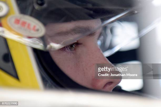 Blaine Perkins, driver of the Four Star Fruit Chevrolet, sits in his car during practice for the NASCAR K&N Pro Series West Coast Stock Car Hall of...
