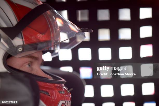 Derek Thorn, driver of the Sunrise Ford/Eibach Springs/Braille Batteries/ Lucas Oil Ford, sits in his car during practice for the NASCAR K&N Pro...