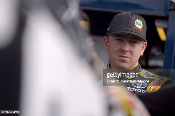 Chris Eggleston, driver of the NAPA Filters Toyota, stands next to his car during practice for the NASCAR K&N Pro Series West Coast Stock Car Hall of...