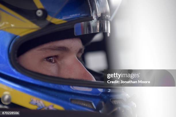 Todd Gilliland, driver of the NAPA Auto Parts Toyota, sits in his car during practice for the NASCAR K&N Pro Series West Coast Stock Car Hall of Fame...