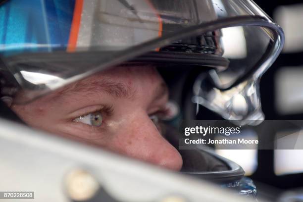 Riley Herbst, driver of the Terrible Herbst Toyota, sits in his car during practice for the NASCAR K&N Pro Series West Coast Stock Car Hall of Fame...
