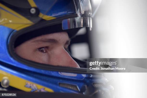Todd Gilliland, driver of the NAPA Auto Parts Toyota, sits in his car during practice for the NASCAR K&N Pro Series West Coast Stock Car Hall of Fame...