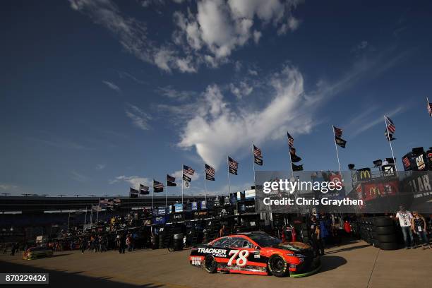 Martin Truex Jr., driver of the Bass Pro Shops/Tracker Boats Toyota, drives during practice for the Monster Energy NASCAR Cup Series AAA Texas 500 at...