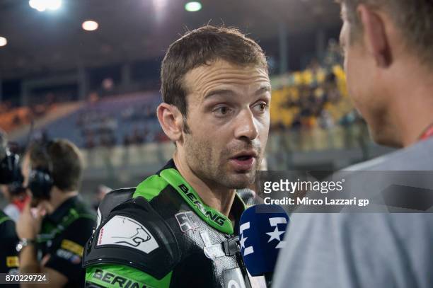 Sylvain Guintoli of France and Kawasaki Puccetti Racing speaks wth journalists on the grid during the Superbike race 2 during the FIM Superbike World...
