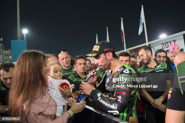 Kenan Sofuoglu of Turkey and Kawasaki Puccetti Racing celebrates with the family and team the third place during the Supersport race during the FIM...