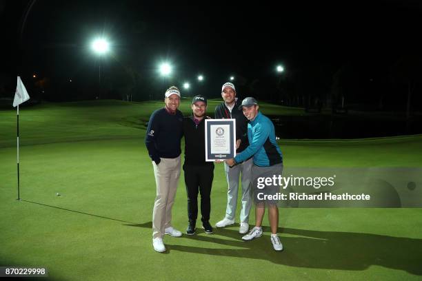 Ian Poulter, Tyrrell Hatton, Matthew Southgate and Matthew Fitzpatrick celebrate setting a new Guiness World Record for the fastest hole of golf at...