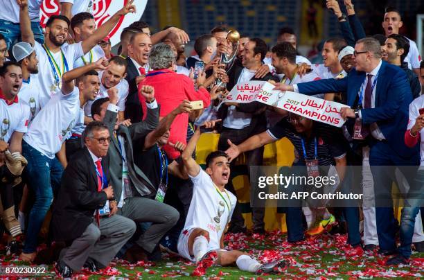 Wydad Casablanca's players celebrate after winning the CAF Champions League final football match between Egypt's Al-Ahly and Morocco's Wydad...