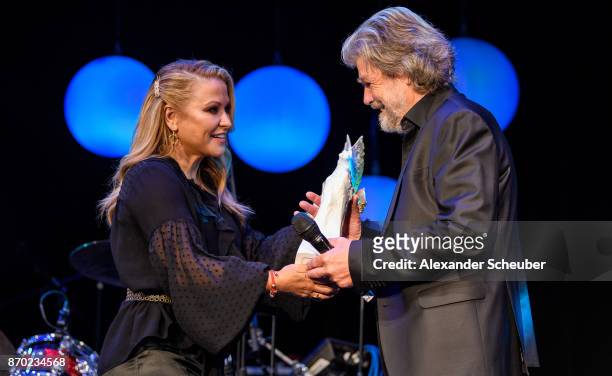 Anastacia hands over the Legend of Sport Award to Reinhold Messner during the German Sports Media Ball at Alte Oper on November 4, 2017 in Frankfurt...