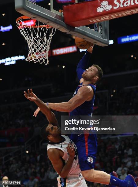Blake Griffin of the LA Clippers elevates for a dunk over Brandan Wright of the Memphis Grizzlies during the second half of the basketball game at...