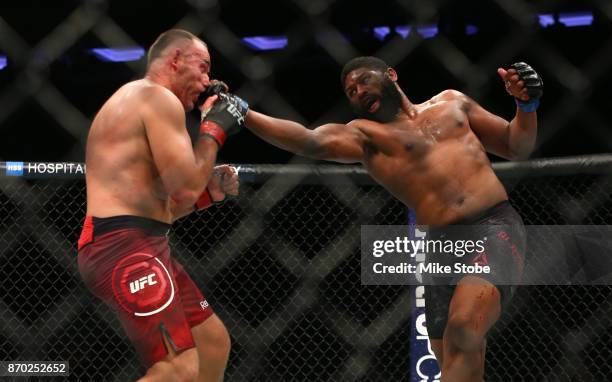 Curtis Blaydes lands a punch against Aleksei Oleinik of Russia in their heavyweight bout during the UFC 217 event at Madison Square Garden on...