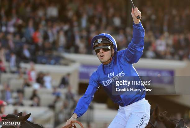 Jockey Mickael Barzalona celebrates after riding Talismanic to a win in the Longines Breeders' Cup Turf on day two of the 2017 Breeders' Cup World...